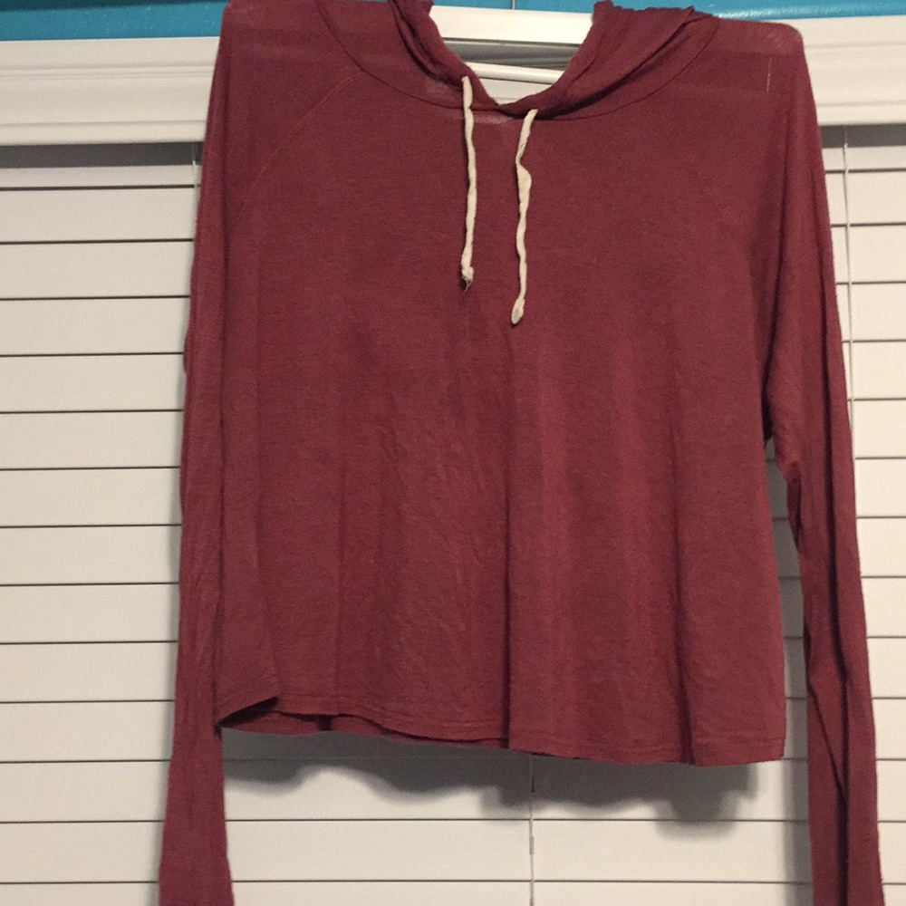 A rose pink long sleeve cropped shirt